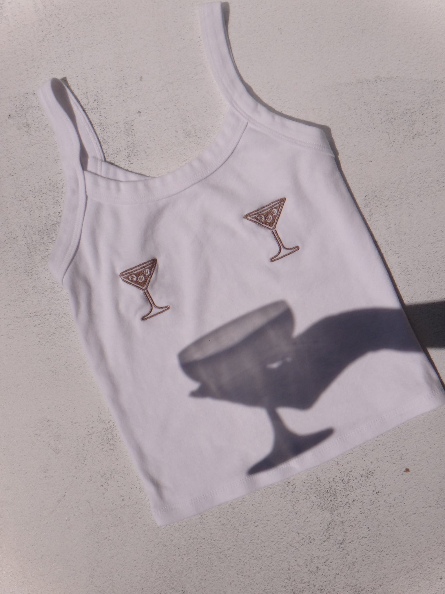 Espresso Martini Tank Top - Cafe Meggo. Ultra-soft and baby-ribbed, exclusive espresso martini decals designed by Cafe Meggo. 